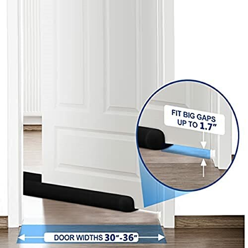 Black door draft stopper fitted under a white door, suitable for gaps up to 1.7 inches and door widths 30 to 36 inches.