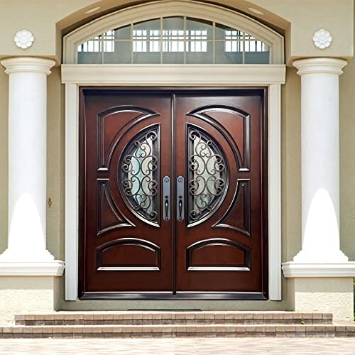 Elegant wooden double doors with decorative glass panels and columns.